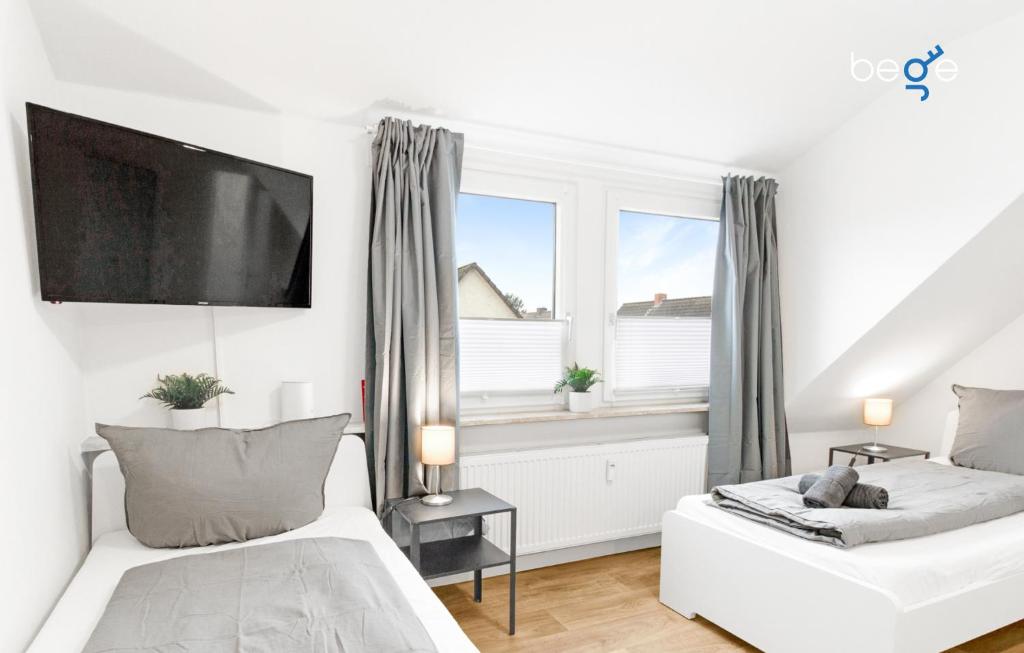 Ένα ή περισσότερα κρεβάτια σε δωμάτιο στο BEGE APARTMENTS SmallGroupStay