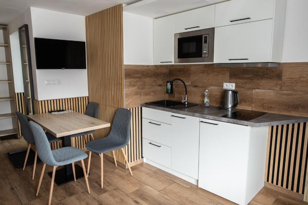 Kuchyň nebo kuchyňský kout v ubytování Hotel U Kociana