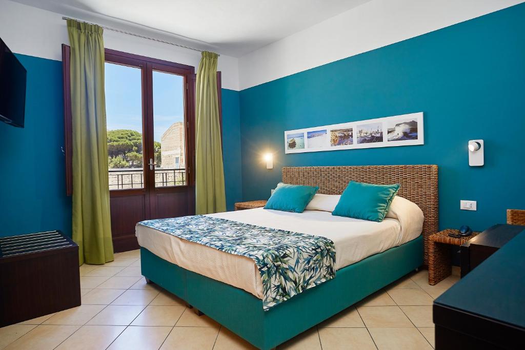 Posteľ alebo postele v izbe v ubytovaní Insula Hotel