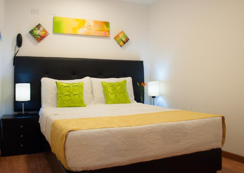 Postel nebo postele na pokoji v ubytování Hotel Ferias Park