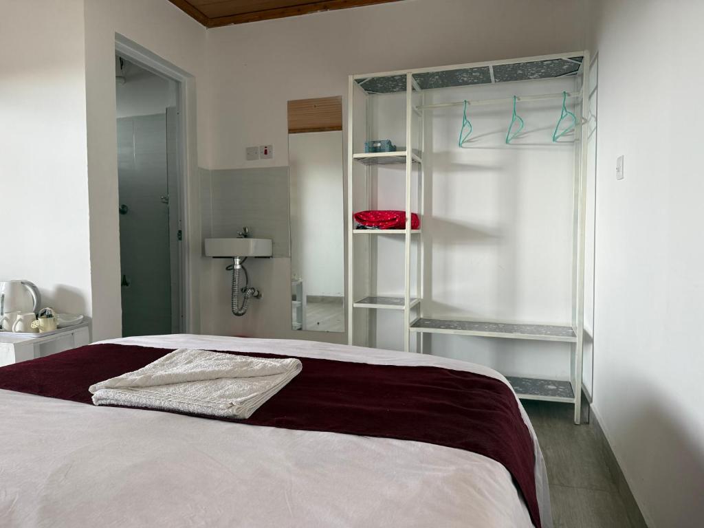 Postel nebo postele na pokoji v ubytování Jazby Guest House, Naivasha