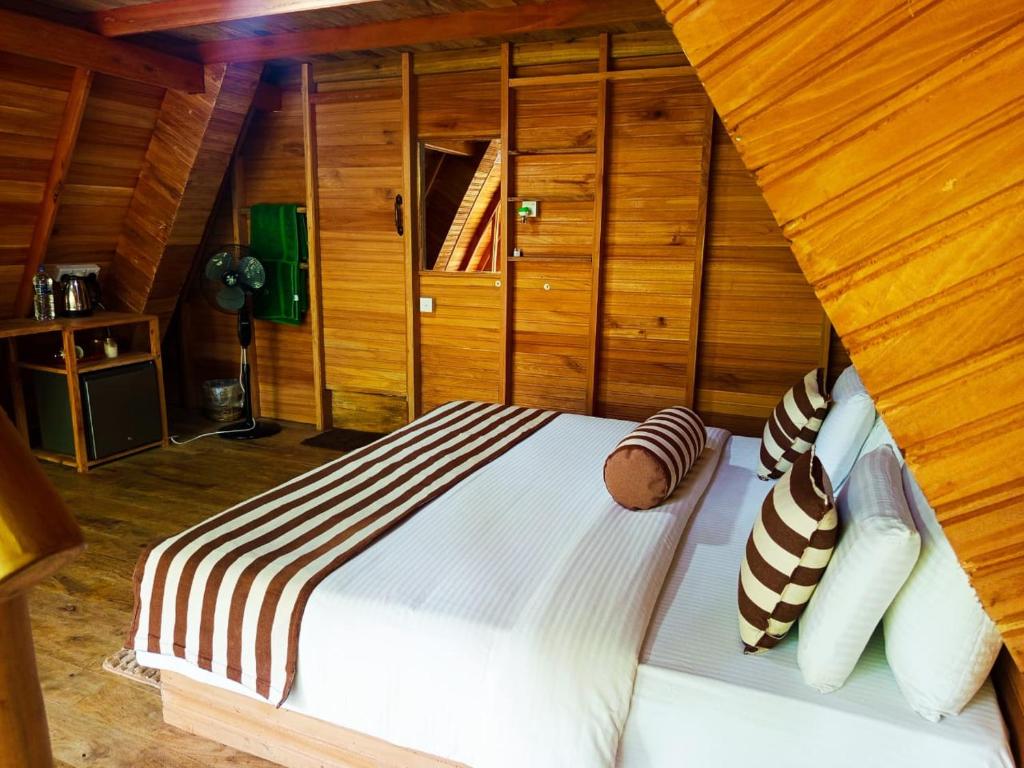 Postel nebo postele na pokoji v ubytování Eco Village