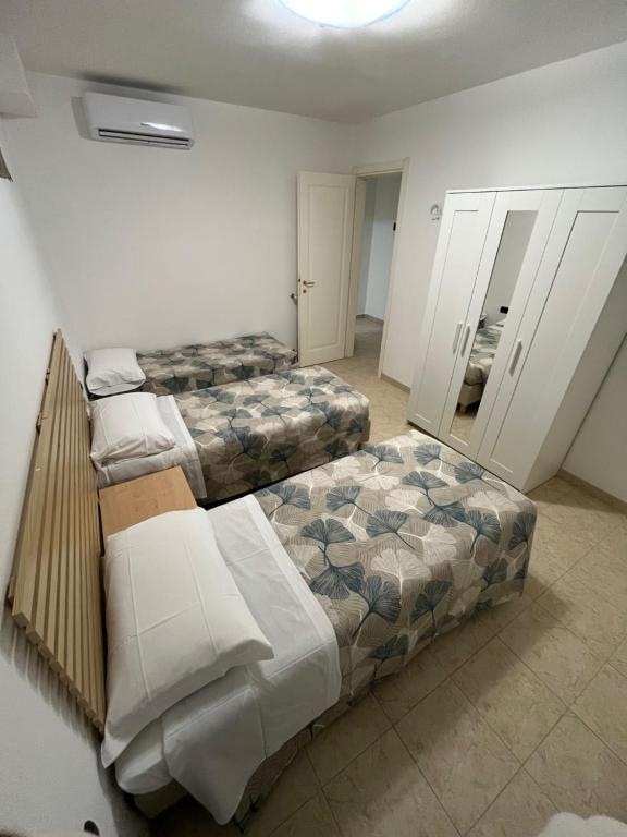 Postel nebo postele na pokoji v ubytování Gli Ulivi Di Montalbano