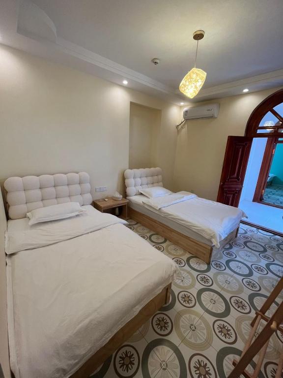 Postel nebo postele na pokoji v ubytování Alley B&B