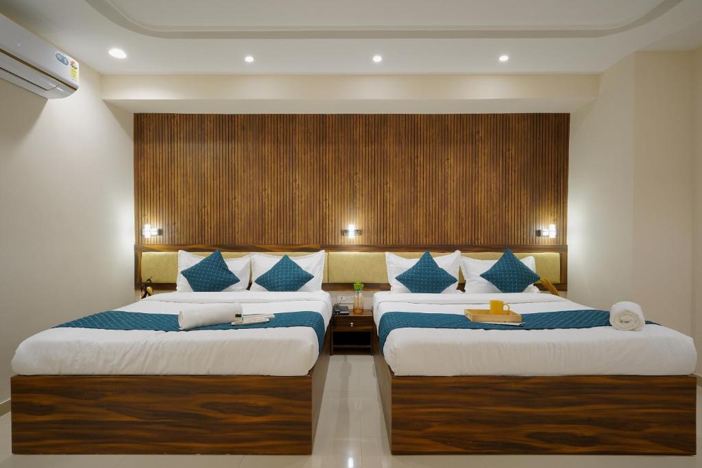 Postel nebo postele na pokoji v ubytování Hotel Elite inn