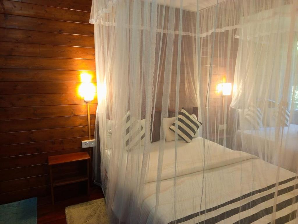 Postel nebo postele na pokoji v ubytování Eco Village
