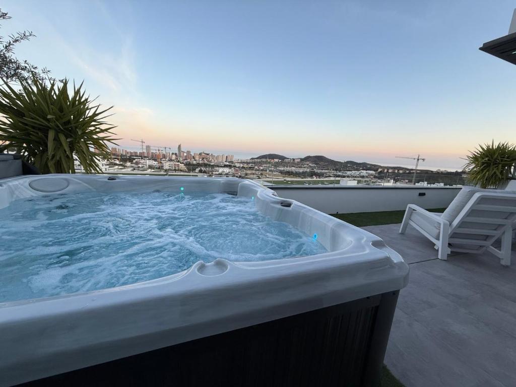 a hot tub sitting on top of a balcony at SUNNY home in Finestrat