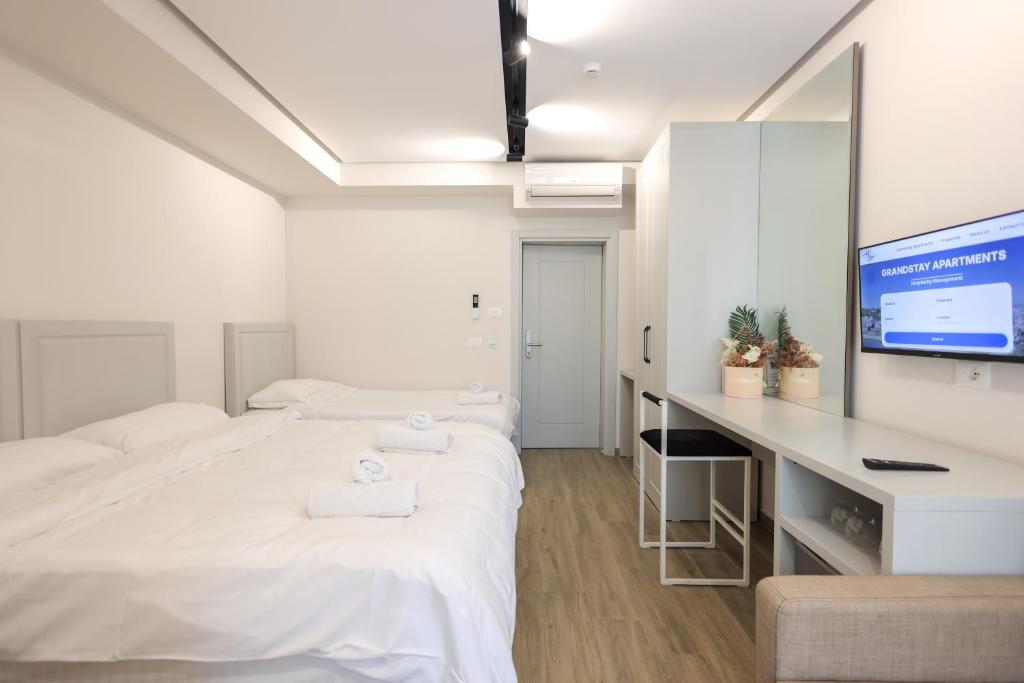 Postel nebo postele na pokoji v ubytování Beach Guesthouse