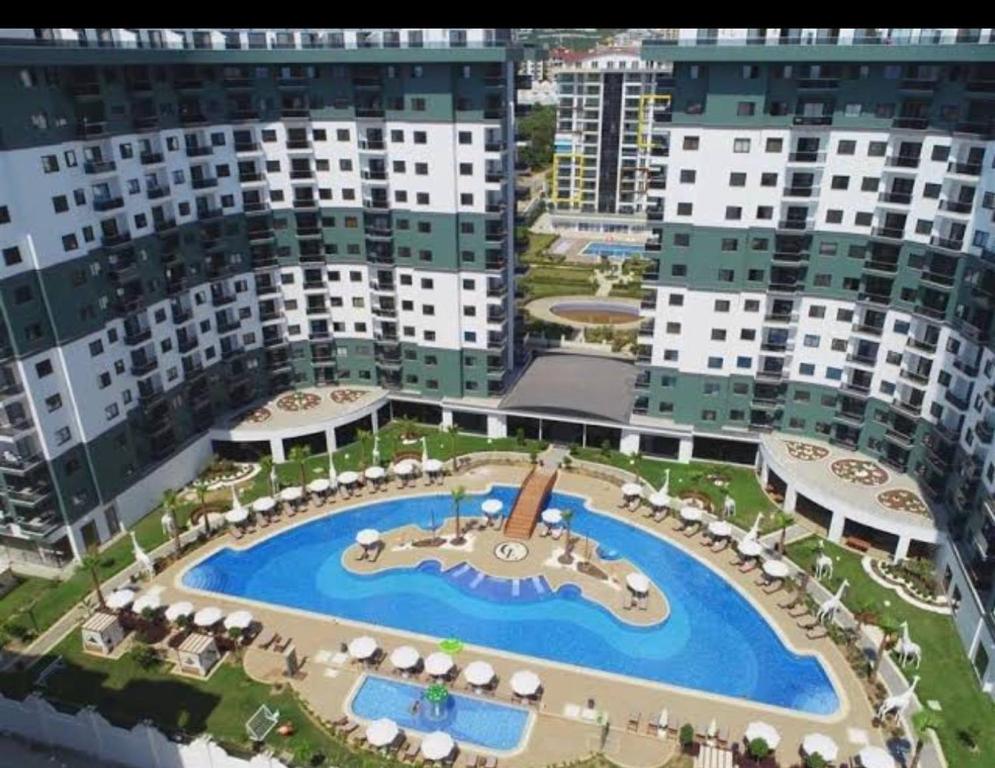 an aerial view of a resort with a swimming pool at Serenity Resedence Duplex Lux 2 bedrooms Mahmutlar in Alanya