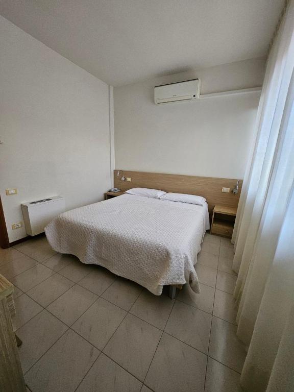 Postel nebo postele na pokoji v ubytování Albergo Nyers
