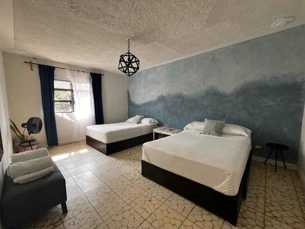 Postel nebo postele na pokoji v ubytování Lool Beh Hostal
