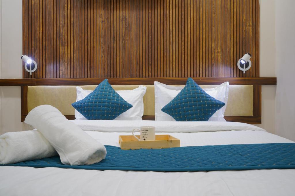 Postel nebo postele na pokoji v ubytování Hotel Elite inn