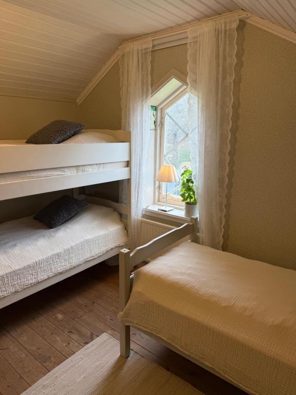 Postel nebo postele na pokoji v ubytování Notholmen, Tyresö