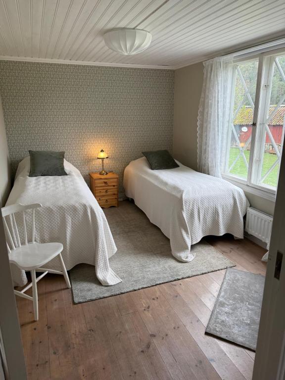 Postel nebo postele na pokoji v ubytování Notholmen, Tyresö