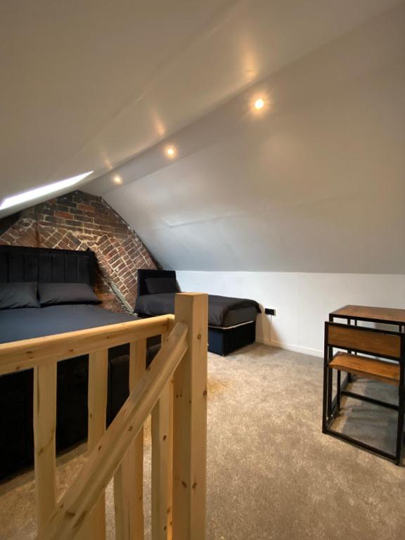 a living room with a bed and a table at Cardiff Central Home Sleeps 11 in Cardiff