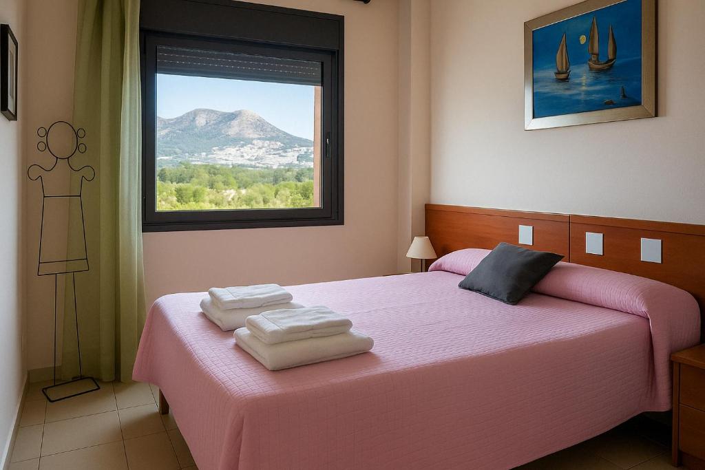 Posteľ alebo postele v izbe v ubytovaní Roses Confort Beach EV Milleni