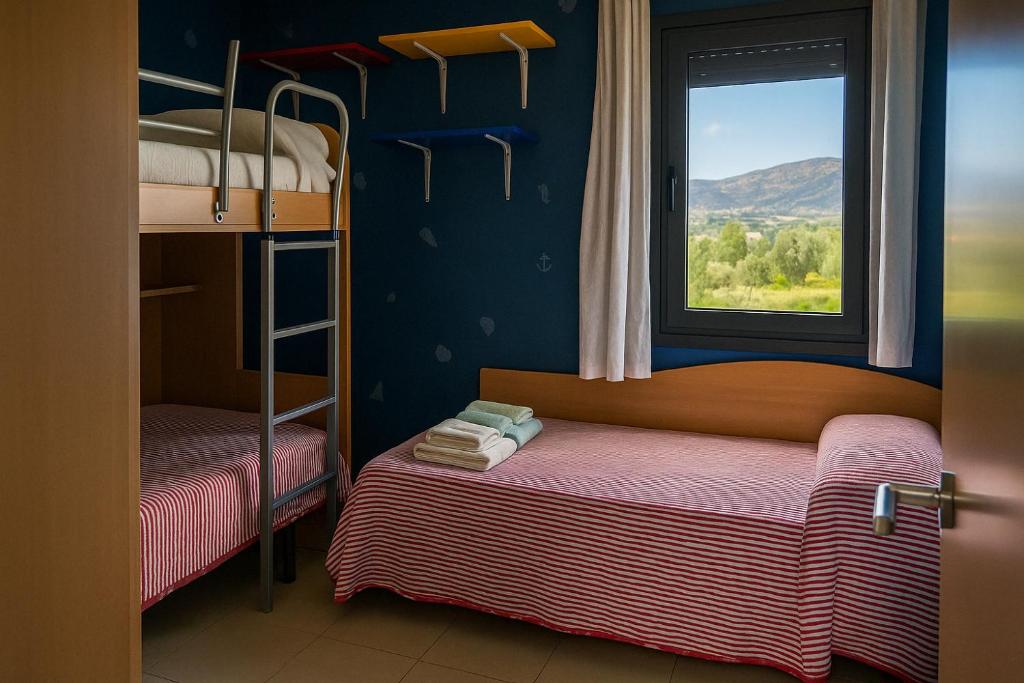 Posteľ alebo postele v izbe v ubytovaní Roses Confort Beach EV Milleni