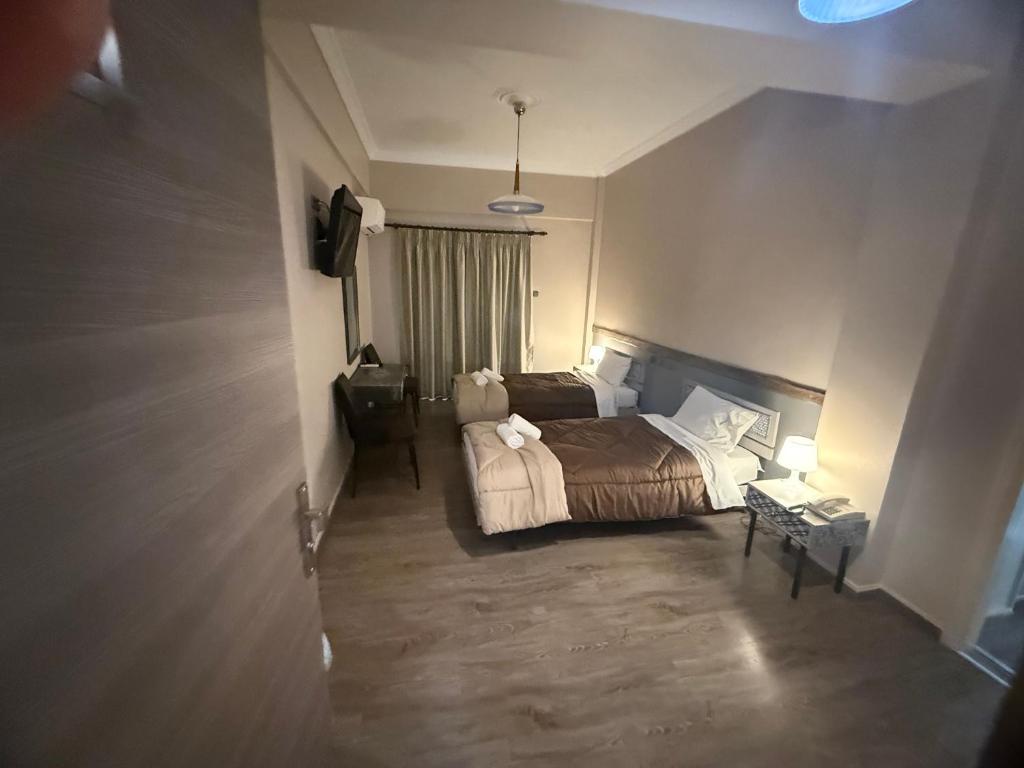 Postel nebo postele na pokoji v ubytování Hotel Koutriaris
