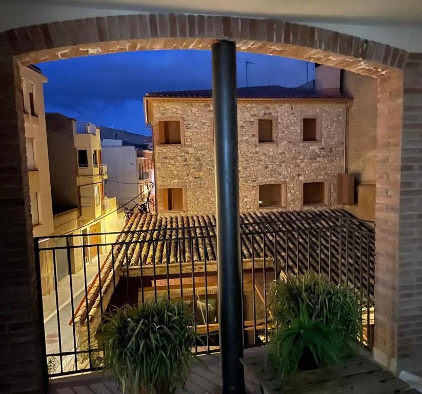 a view of a building from a balcony at night at Apartament Rural ca la Roser in Espluga de Francolí