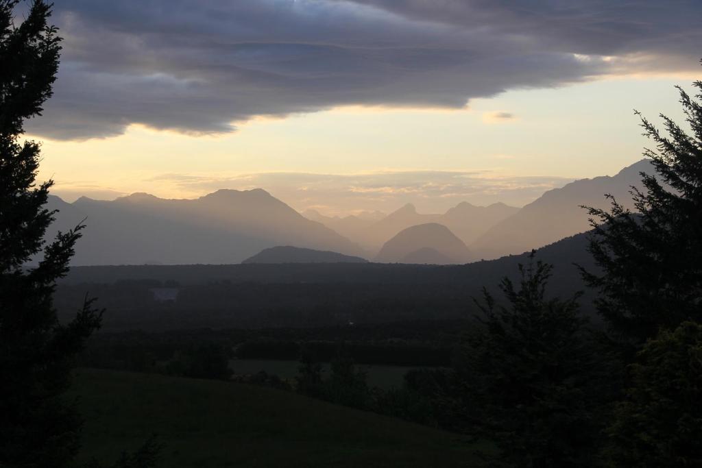 a view of a mountain range at sunset at Barnyard Backpackers Te Anau in Te Anau