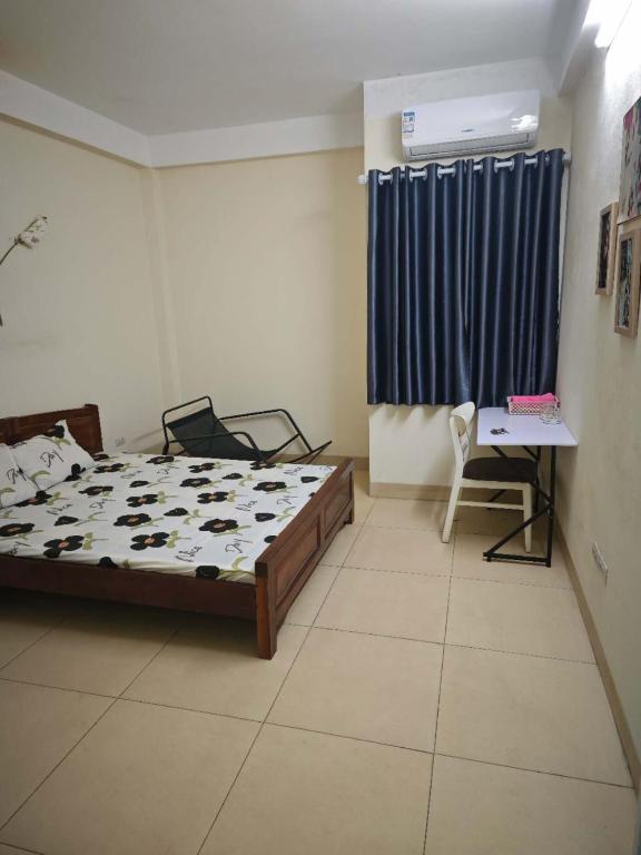 Postel nebo postele na pokoji v ubytování WRX guest house