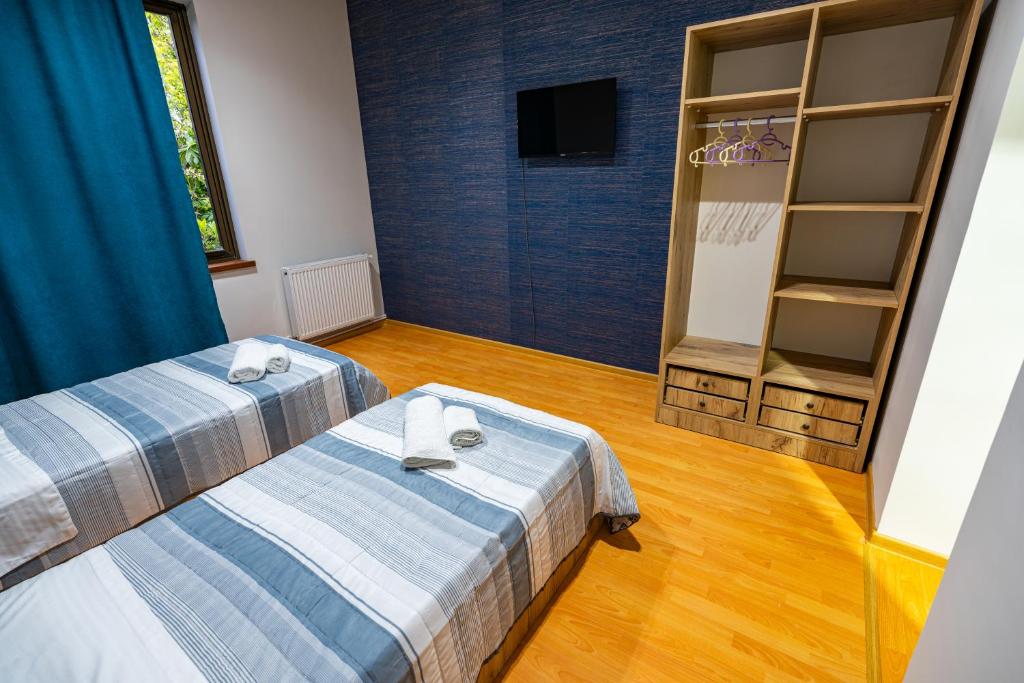 Postel nebo postele na pokoji v ubytování Hotel Elemtega Kutaisi