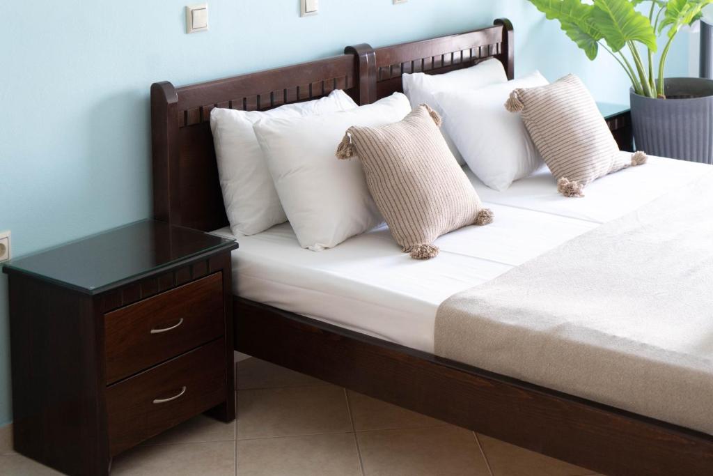 Postel nebo postele na pokoji v ubytování Hotel Alexandros