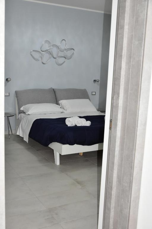 Postel nebo postele na pokoji v ubytování Yllen Rooms