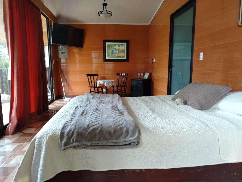 Postel nebo postele na pokoji v ubytování Suite y Loft Casa Toría