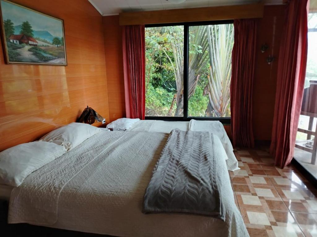 Postel nebo postele na pokoji v ubytování Suite y Loft Casa Toría