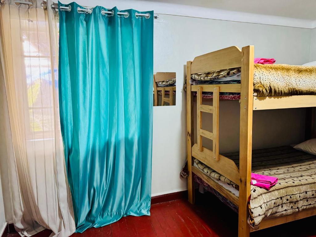 Postel nebo postele na pokoji v ubytování Ukumari Hostel