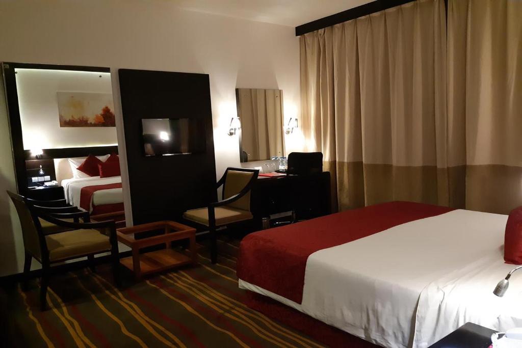 Postel nebo postele na pokoji v ubytování Hotel Luxe Stay Near Delhi Airport