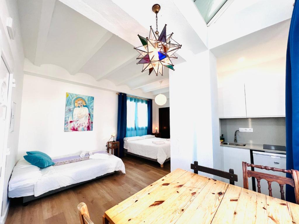A bed or beds in a room at El Beaterio Apartments