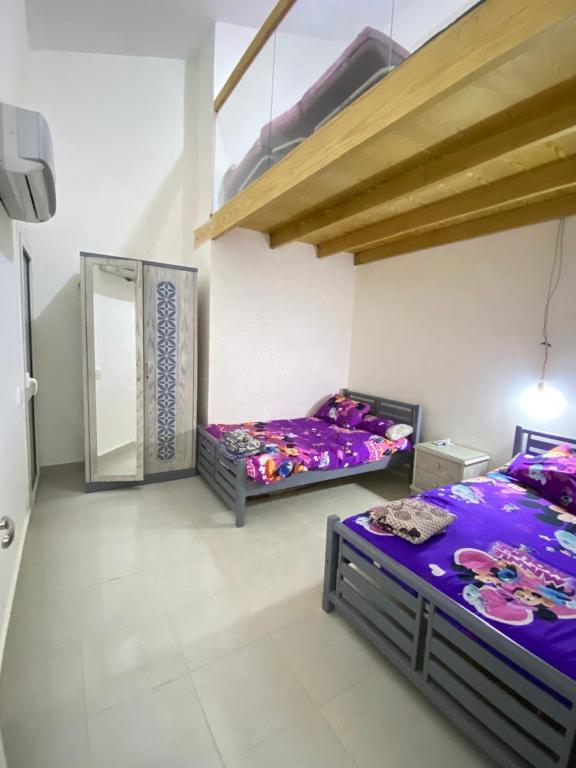 Postel nebo postele na pokoji v ubytování Morano wadi degla العين السخنة