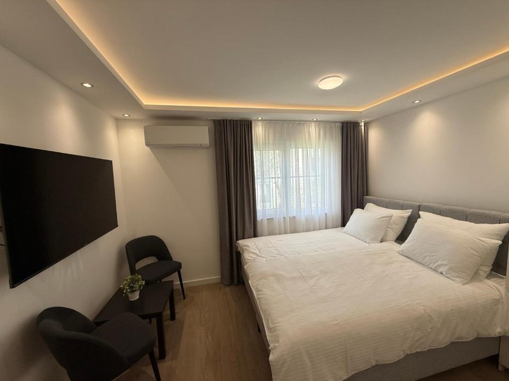 Postel nebo postele na pokoji v ubytování Apartmani Maira