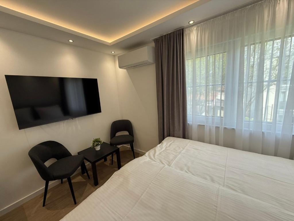 TV a/nebo společenská místnost v ubytování Apartmani Maira