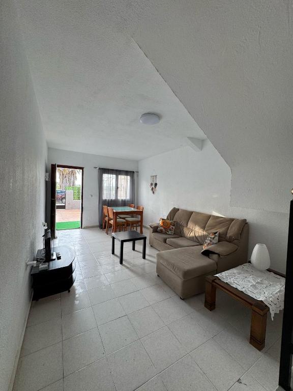 a living room with a couch and a table at Mabel in San Javier