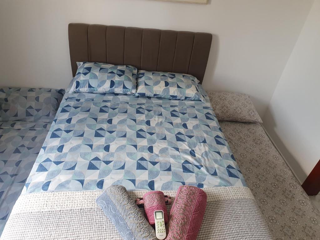 Postel nebo postele na pokoji v ubytování Quarto & Conforto