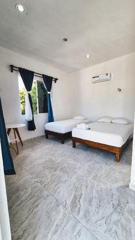 Postel nebo postele na pokoji v ubytování Hotel Monserrat