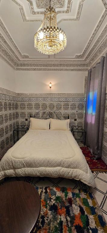 Postel nebo postele na pokoji v ubytování Riad Raffaa