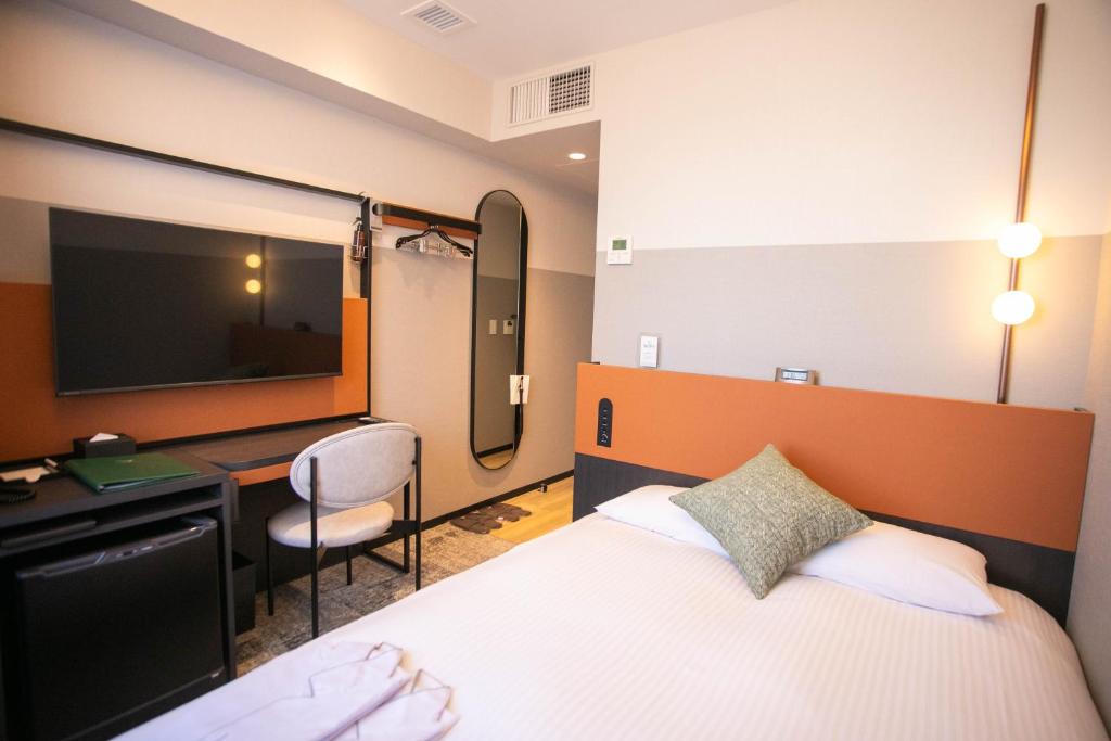 Postel nebo postele na pokoji v ubytování Wishton Hotel Yukari