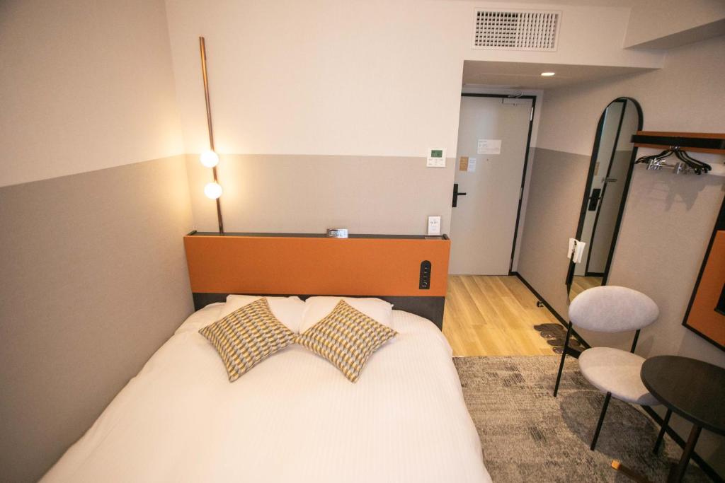Postel nebo postele na pokoji v ubytování Wishton Hotel Yukari