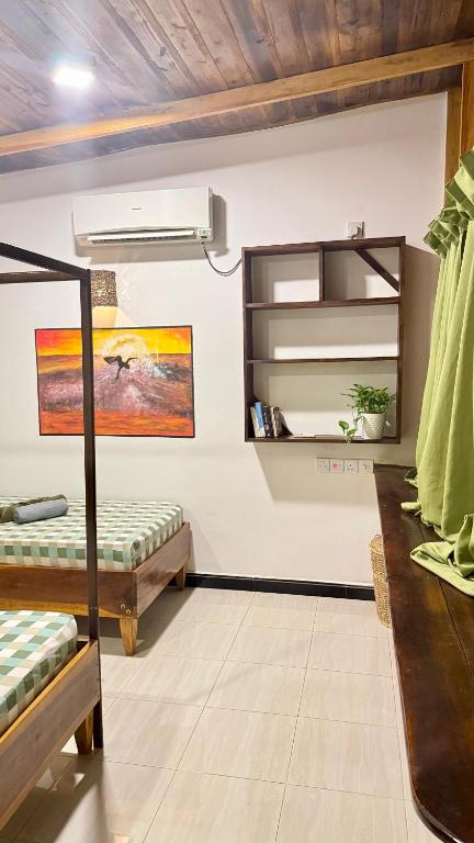 Postel nebo postele na pokoji v ubytování Arcadia villas Arugambay