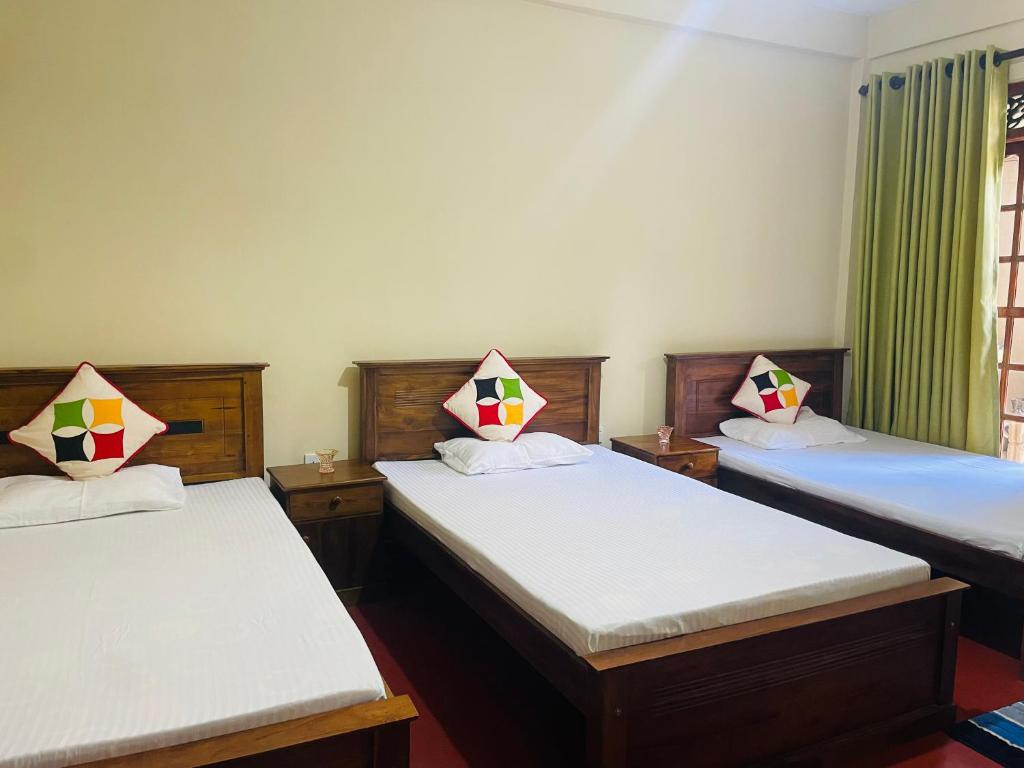 Postel nebo postele na pokoji v ubytování Ulpatha Guest House