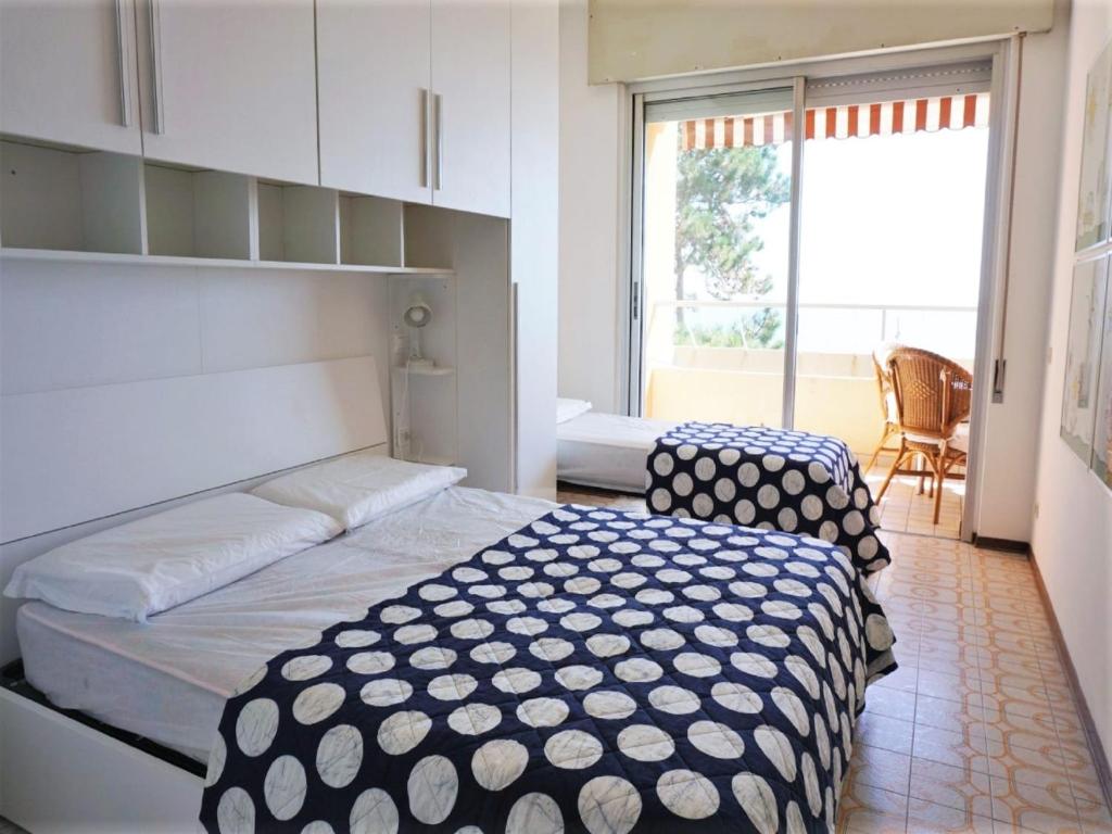 A bed or beds in a room at Nice apartment in Porto Santa Margherita with terrace