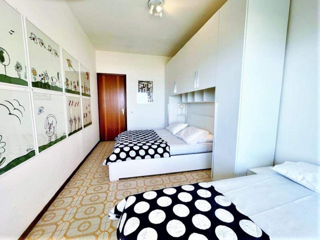 A bed or beds in a room at Nice apartment in Porto Santa Margherita with terrace