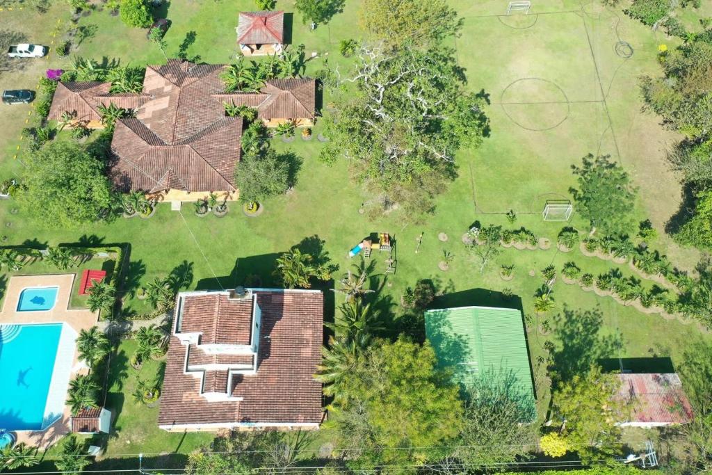 an aerial view of a house with a yard at Yopo Resort in Pedregal