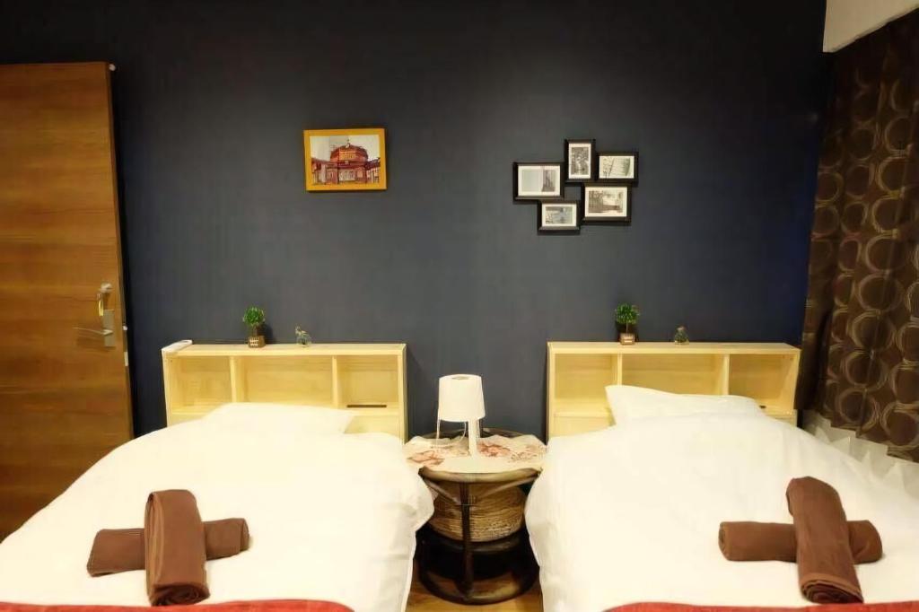 Postel nebo postele na pokoji v ubytování AN HOTEL