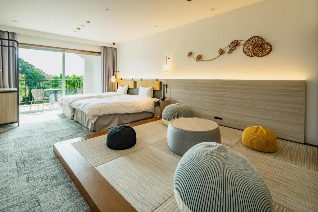 Postel nebo postele na pokoji v ubytování Miyako Resort Shima Bayside Terrace