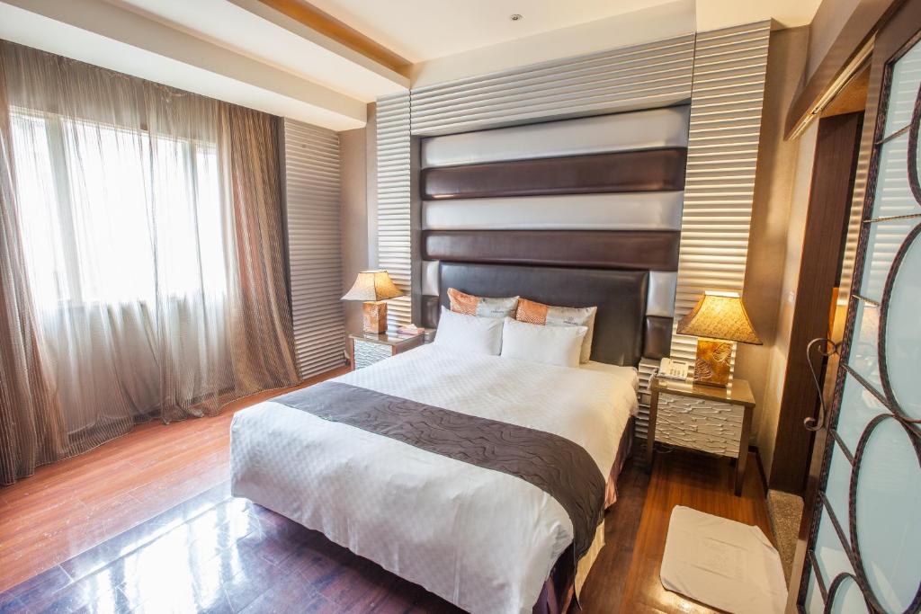 Postel nebo postele na pokoji v ubytování Spring Breeze Hotel